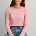 Pink women’s fitted crew-neck long-sleeve T-shirt on model