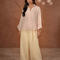 Women's wide-leg solid trousers, light cream, front view with wide relaxed waistband