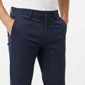 Navy slim-fit chinos close-up of waistband button and front pockets