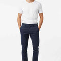 Men's navy slim-fit chinos worn full-body, straight leg