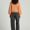 Women's peach knitted sweater, back view, crew neck, long sleeves