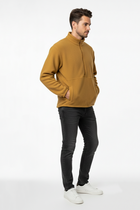Men's camel half-zip sweatshirt on model, front half zip, kangaroo pocket, ribbed cuffs