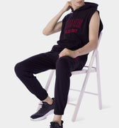 Sleeveless Hoodie For Men - Black model seat on the chair