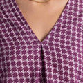 Maroon printed V-neck top with three-quarter sleeves
