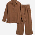 Brown co-ord set shown angled: collared button-up shirt with wide-leg elastic-waist pants.