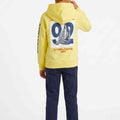 Boys yellow hoodie back view with large sailboat patch and sleeve vertical text