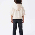 Girls' cream short-sleeve hoodie, hooded back view with kangaroo pocket.