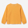 Girls mock orange long-sleeve button blouse with gathered cuffs, back view