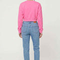 Candy pink womenÃƒÆ’Ã‚Â¢ÃƒÂ¢Ã¢â‚¬Å¡Ã‚Â¬ÃƒÂ¢Ã¢â‚¬Å¾Ã‚Â¢s sweatshirt back view, plain with ribbed cuffs and hem.