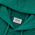 Green hoodie hood lining and drawstring cords detail near neckline.