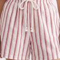 Pink-and-white striped shorts with lace-up drawstring waist