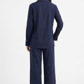Navy women's two-piece set: collared shirt and wide-leg pants, back view.