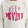 Boys ecru sweatshirt close-up of "KEEP MOVING" pink and magenta print