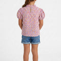 Purple printed blouse with puff sleeves and gathered yoke, keyhole button back