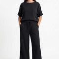 Black textured blouse and wide-leg pants set, short sleeves and drawstring waist