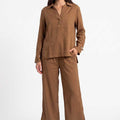 Women's brown co-ord set: long-sleeve button-up shirt and wide-leg pants, front view.