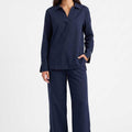 Navy women's co-ord set: collared long-sleeve shirt with matching wide-leg pants.