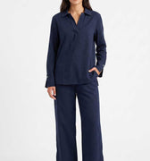 Navy women's co-ord set: collared long-sleeve shirt with matching wide-leg pants.