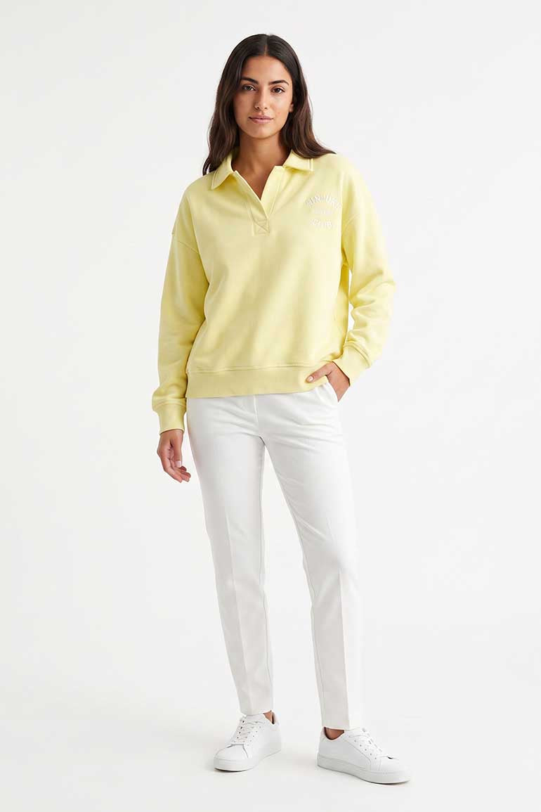 Women's pale yellow polo sweatshirt with collar and button placket, long sleeves