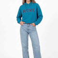 WomenÃ¢â‚¬â„¢s teal MEME logo hoodie with hood, drawstrings, and front kangaroo pocket