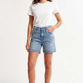 Light blue denim women's shorts with mid-rise waist and front pockets