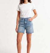 Light blue denim women's shorts with mid-rise waist and front pockets