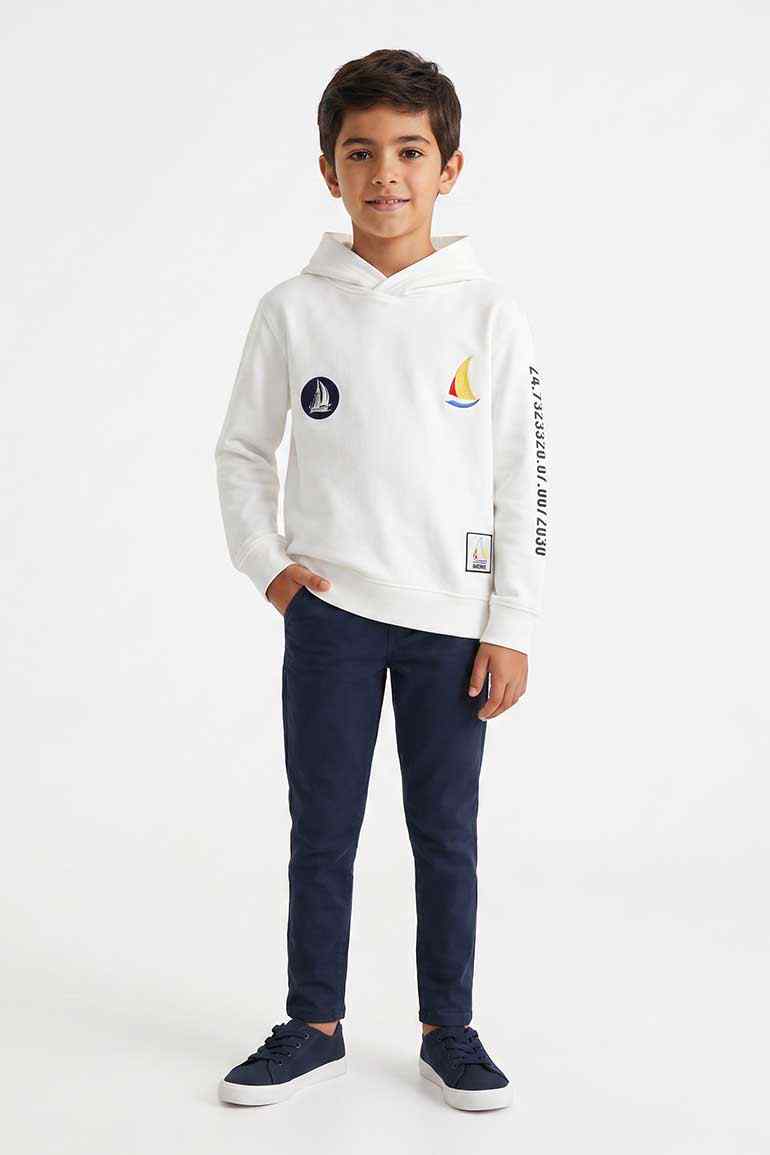 Boys white patchwork hoodie with hood, front pocket, and sailboat graphic patches