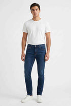 Men's skinny-fit dark blue jeans with zip fly and five-pocket design