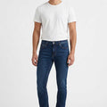 Men's skinny-fit dark blue jeans with zip fly and five-pocket design