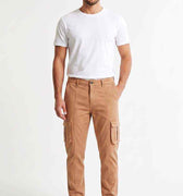 Men's tan cargo trousers on model with side cargo pockets and elastic ankle cuffs