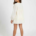 Girls cream dress, long balloon sleeves and gathered skirt, side view