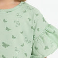 Light green baby girls T-shirt close-up of butterfly print and gathered flutter sleeve