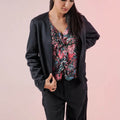 Womenâ€™s short dark blazer with draped open front and long sleeves